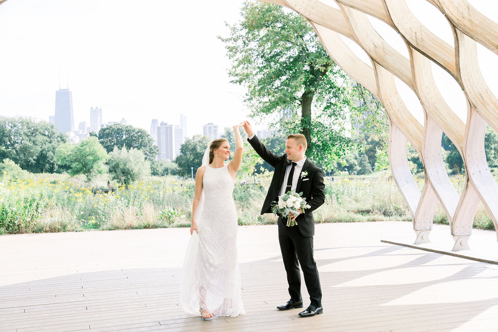 Groom twirls bride in Lincoln Park